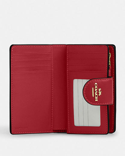 MEDIUM CORNER ZIP WALLET IN SIGNATURE CANVAS